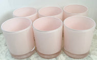 Candle - scented, soy wax candle in a light pink candle jar.
